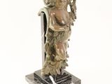 statue of a man holding a harp on a marble base