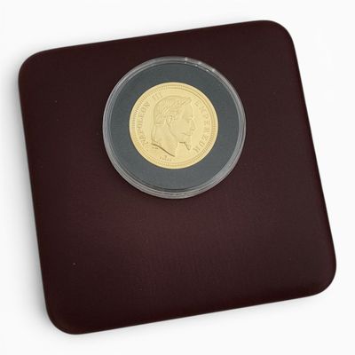 une pièce d'or sur laquelle figure l'image d'un homme