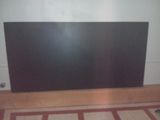 a picture of a flat screen tv sitting on top of a hard wood floor