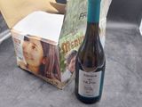 a bottle of wine sitting next to a box of wine