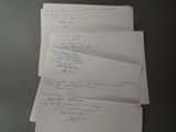 several papers are stacked on top of each other on a table