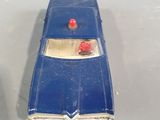 a blue toy car that is sitting on a table
