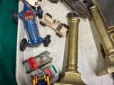 a lot of toy cars and a clock on a tray