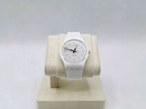 an image of a white watch sitting on top of a white stand
