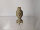 a small vase that is sitting on a glass table