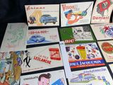 many different types of advertising cards laid out on a table