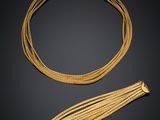 a gold necklace and a gold bracelet