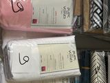 a lot of different types of fabric on a shelf