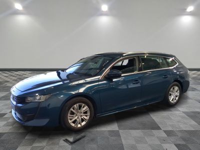 a picture of a blue car parked in a garage