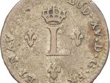 an old coin with a crown on it