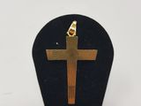 a close up of a wooden cross on a black stand