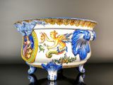 a blue and white bowl with a lion on it