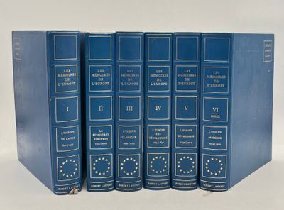 four blue books are stacked on top of each other on a white surface