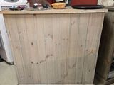 a small kitchen with a wooden counter and a white stove