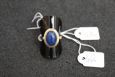 a ring with a blue stone on it and a price tag