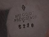 a close up of a silver plate with the words men o ' doo prevoostice on it
