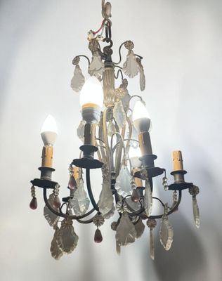 a chandelier that has a bunch of candles on it