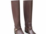 a close up of a pair of brown boots on a white background