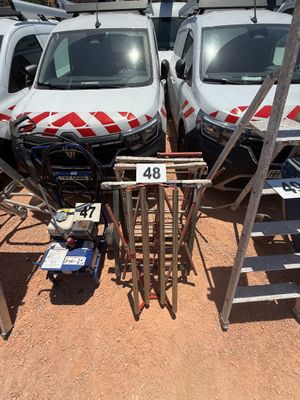 two vans parked next to each other in a parking lot