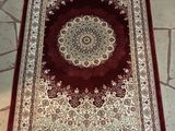 rug on the floor is red and white with a medallion design