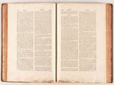 an open book on a table with a white background