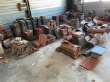 a large amount of wood and metal items in a warehouse