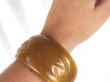 a person that is holding a piece of food in their hand
