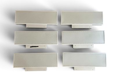 four white boxes are stacked on top of each other on a white surface