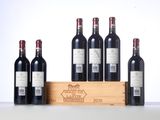 six bottles of red wine in a wooden crate on a table