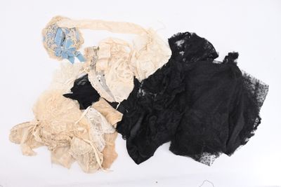 three pieces of clothing that are on a white surface