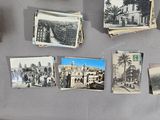 many old photos hanging on the wall of this room