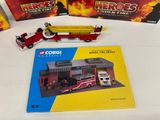 three books on a table with a fire truck and a fire truck