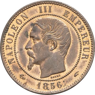 Gros plan sur une pièce de monnaie portant le visage d'un homme