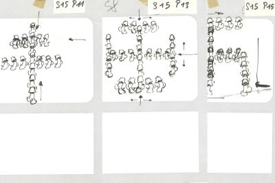 a white board with stickers on it that have drawings of people on it