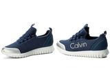 a pair of shoes with the name calvin on them