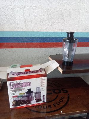 a box of food sitting on a table next to a blender