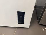 an image of a small white refrigerator in a kitchen