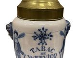 an image of a blue and white jar with a gold lid