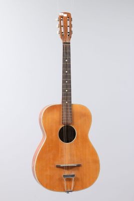 a close up of a guitar hanging from a string