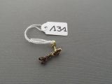 a picture of a small piece of jewelry on a string
