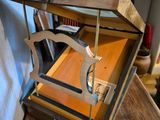 a wooden box that has a clock inside of it