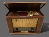 an old fashioned record player sitting on top of a wooden table