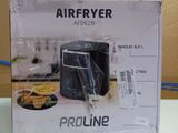 packaging of a black air fryer sitting on top of a white counter