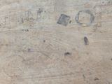 a piece of wood that has some writing on it