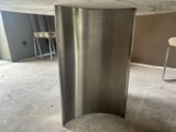 a marble table with a metal base in the middle of a room