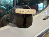 a sticker on the side mirror of a white car