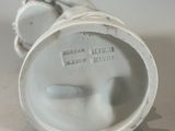 a white vase with a face on it on a table