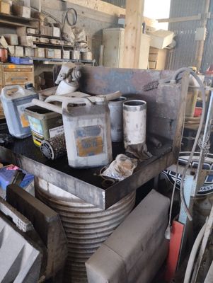 a pile of junk that is sitting in a garage