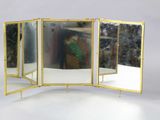 Miroir à quatre panneaux en laiton, avec cadre et pieds en laiton