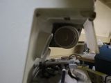 a white sewing machine sitting on a counter in a room